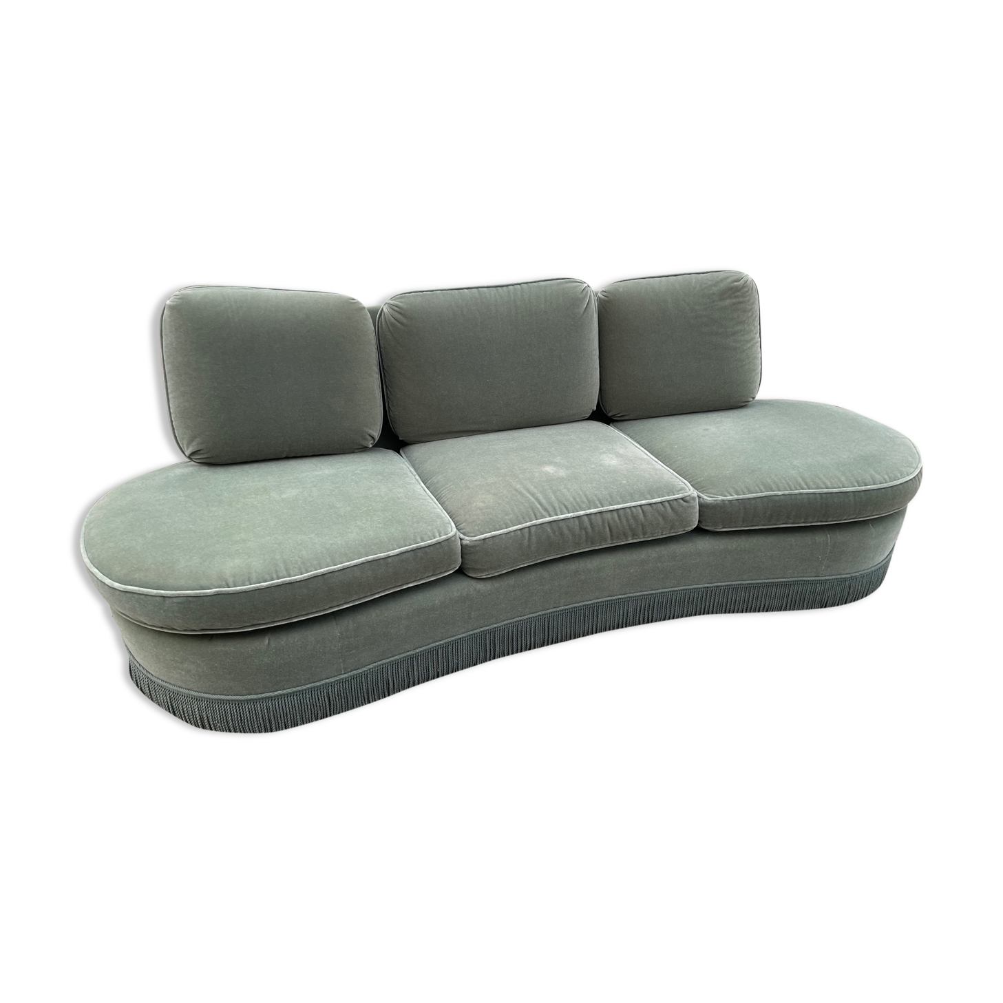 Rounded sofa with fringes
