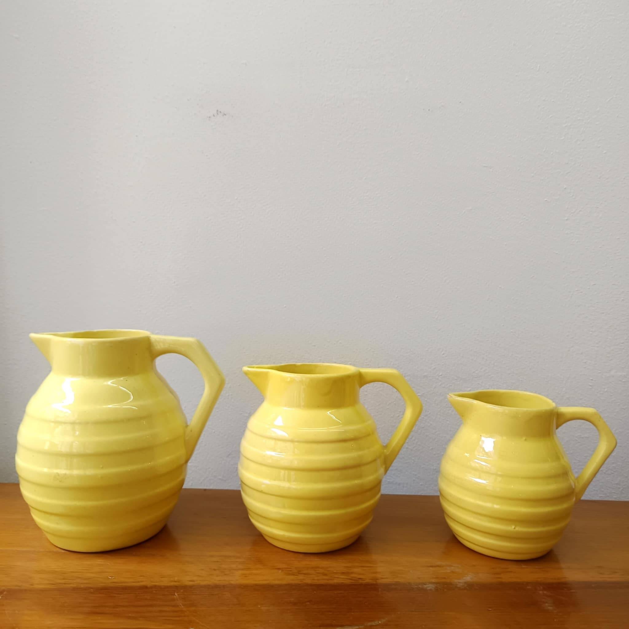 3 Orchies art deco pitchers in yellow ceramic
