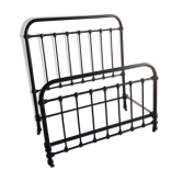 old bed with vintage painted metal bars