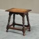 Rustic stool or side table in turned and carved solid oak, 19th century.