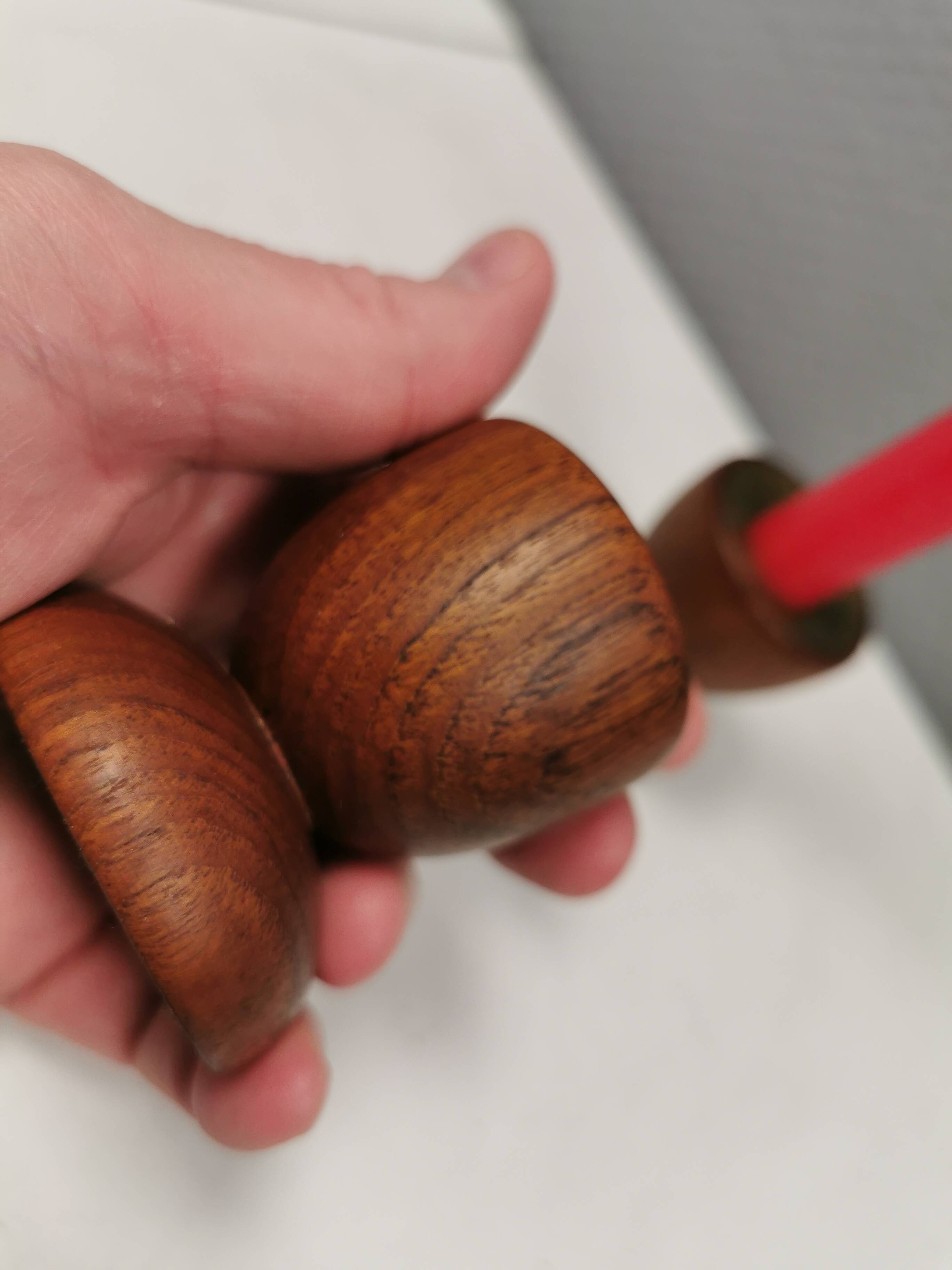 Two beautiful teak candle holders with brass inserts.