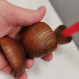 Two beautiful teak candle holders with brass inserts.
