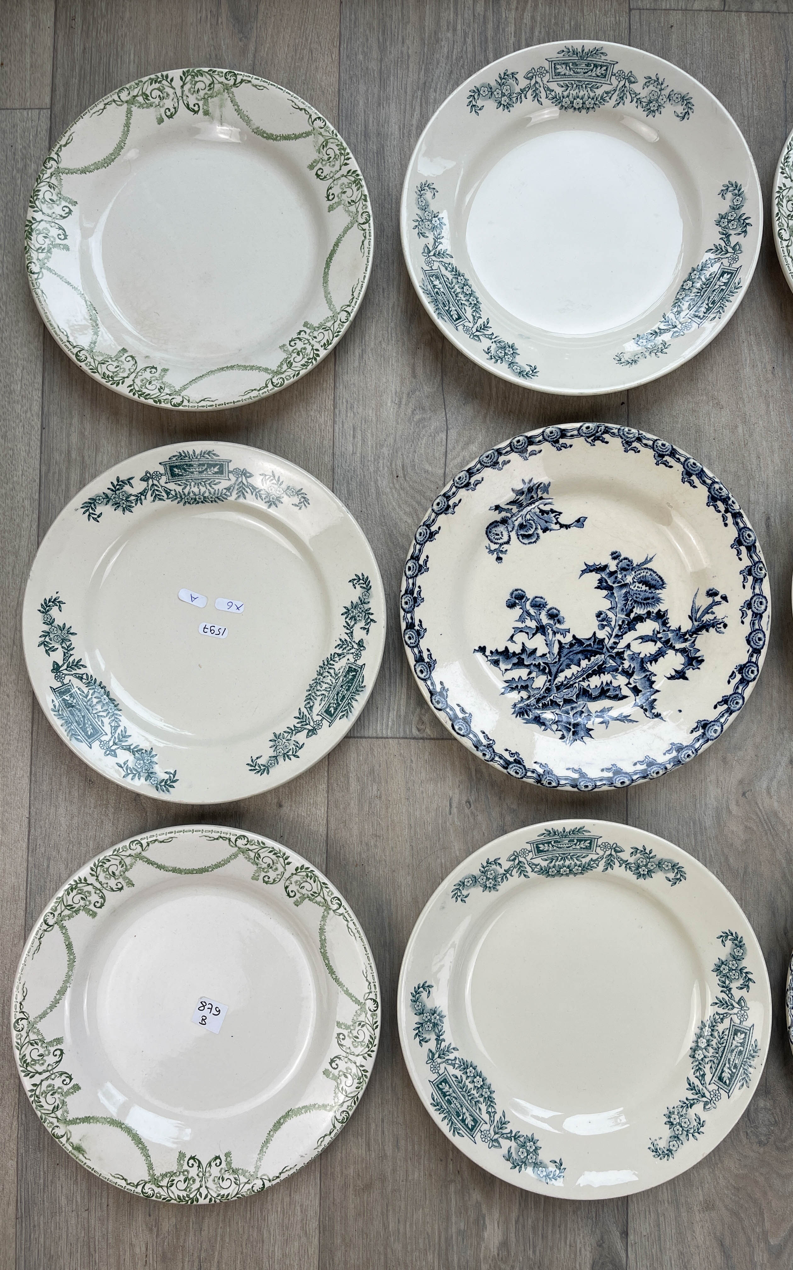 6 green and blue mismatched iron earth plates