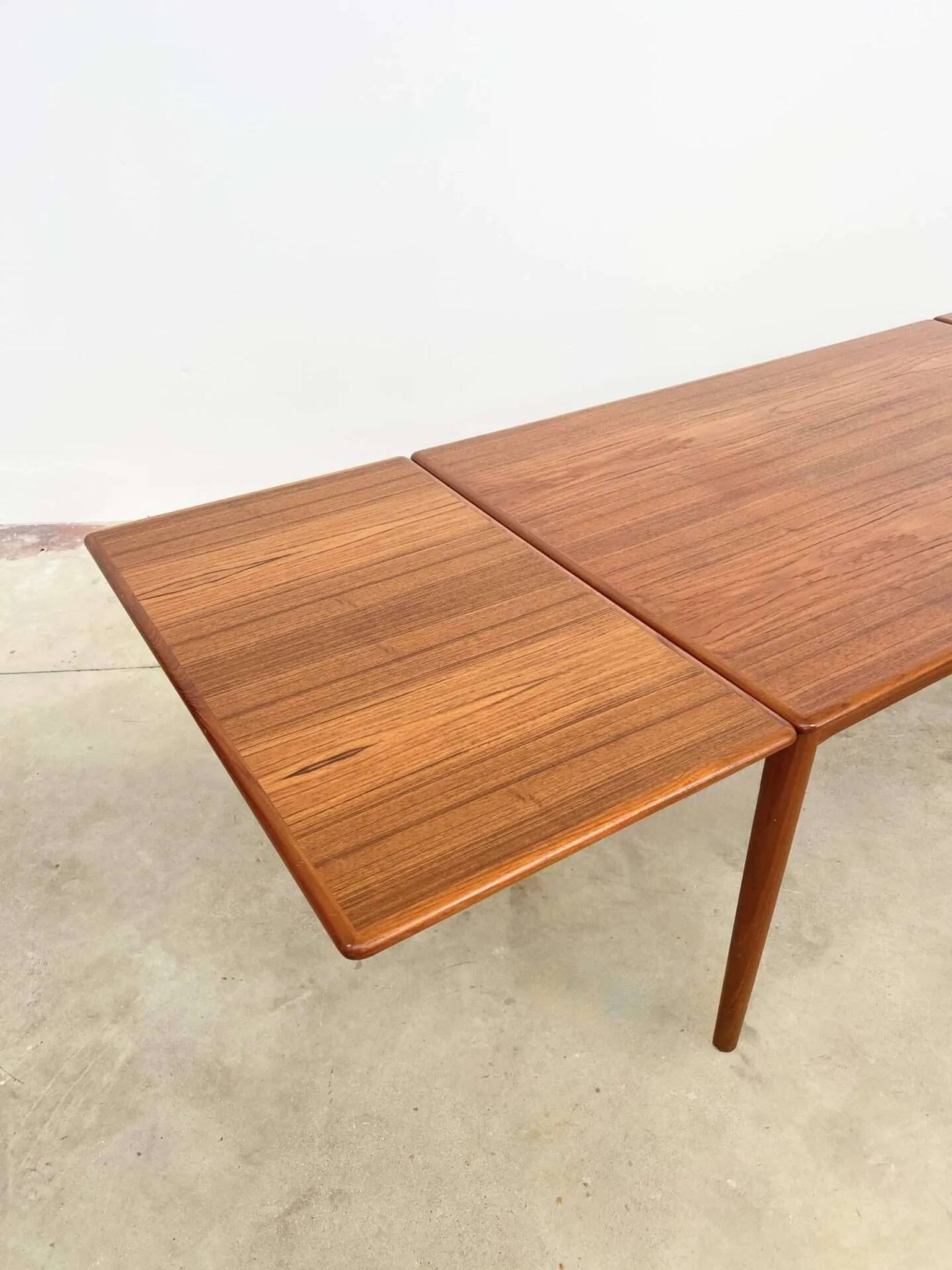 Teak dining table with integrated extensions — Scandinavian