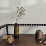 Natural wood chest forming a bench, ringed shoulders