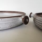 Pair of enamelled sandstone dishes