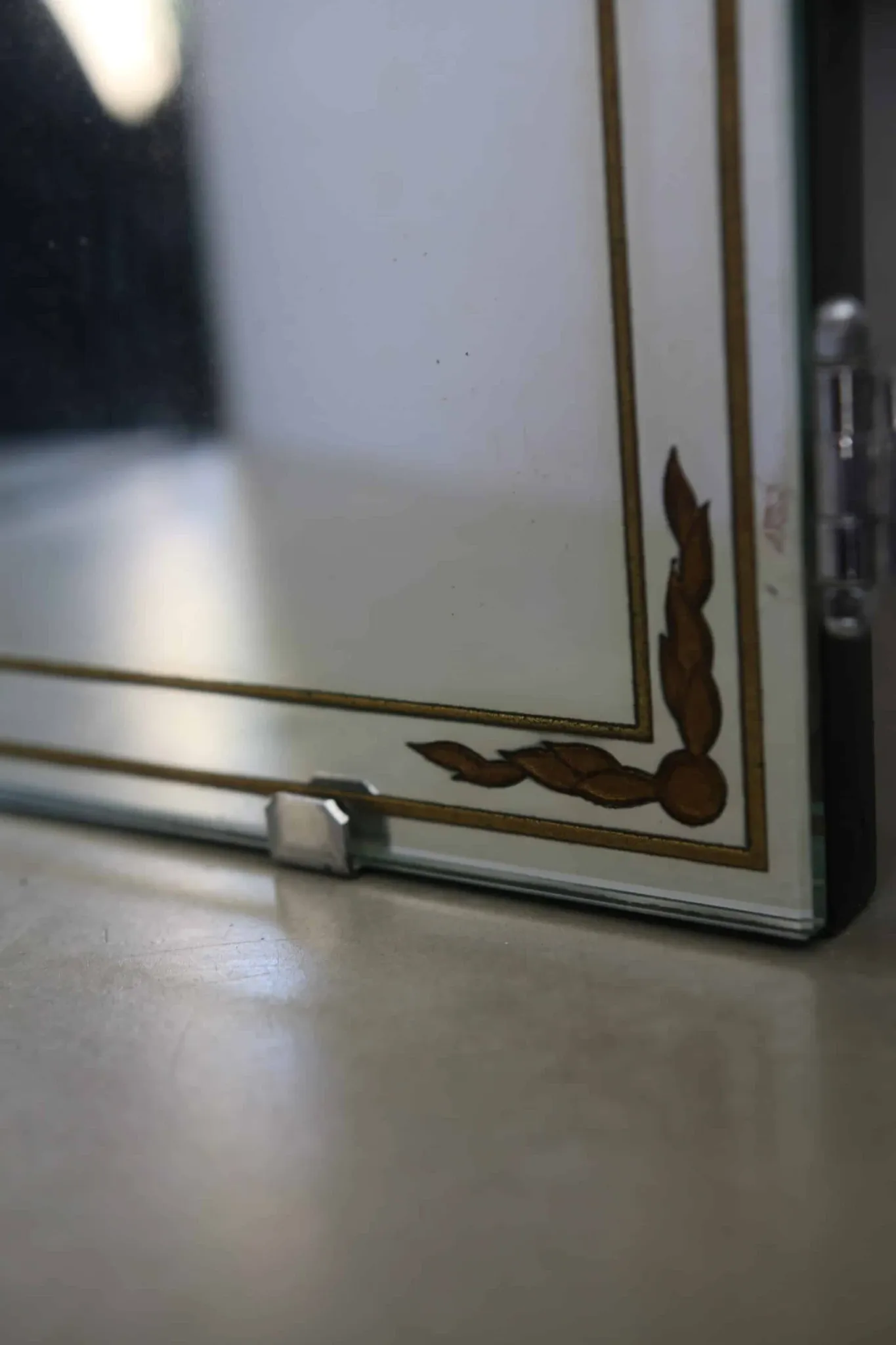 Triptych mirror with eglomisé and pediment, 1940s-50s