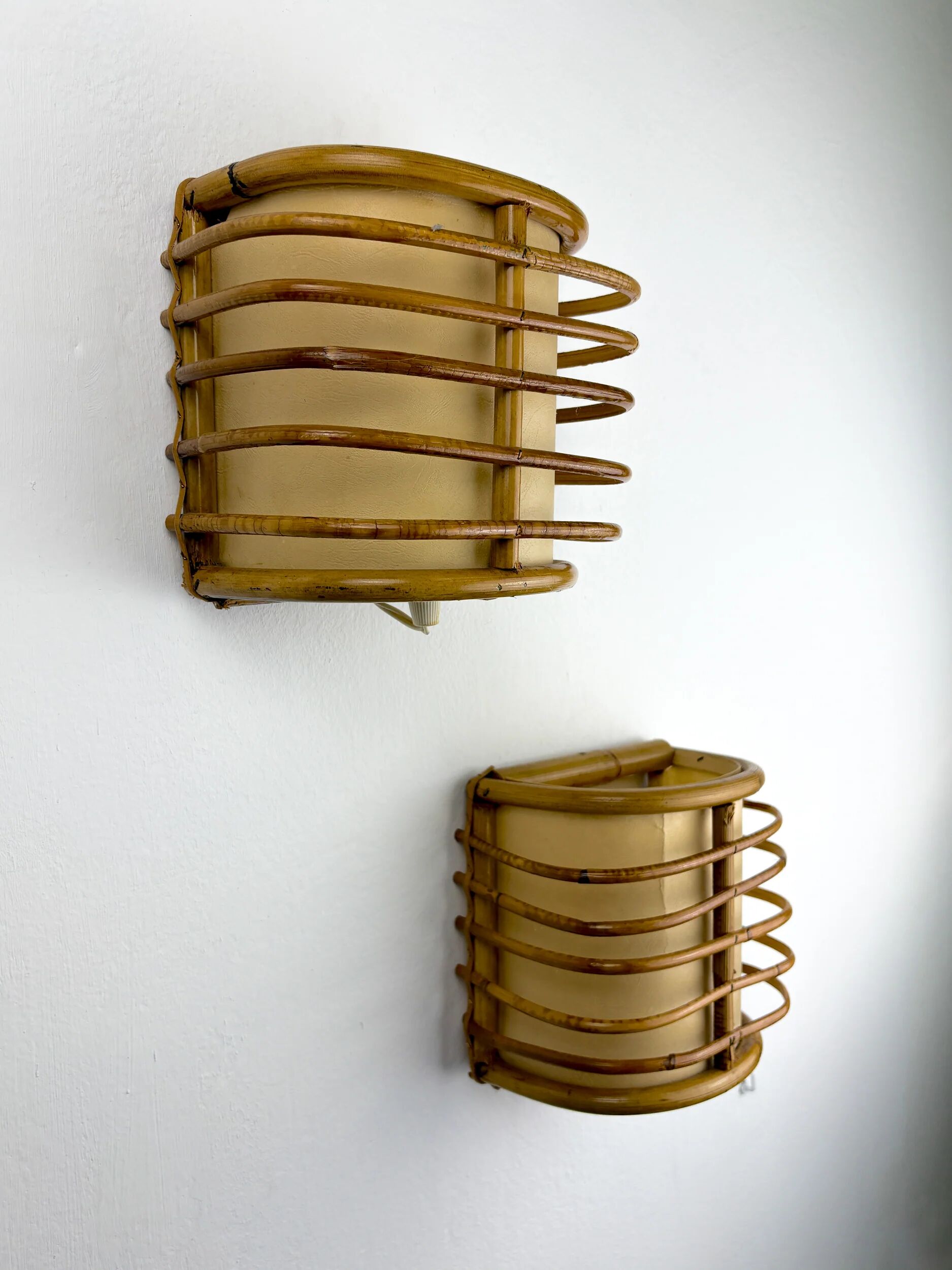 Pair of mid-century rattan wall sconces, circa 1960s, Italy