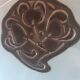 Handcrafted glass fruit bowl with ribbed design set with pewter medallions.