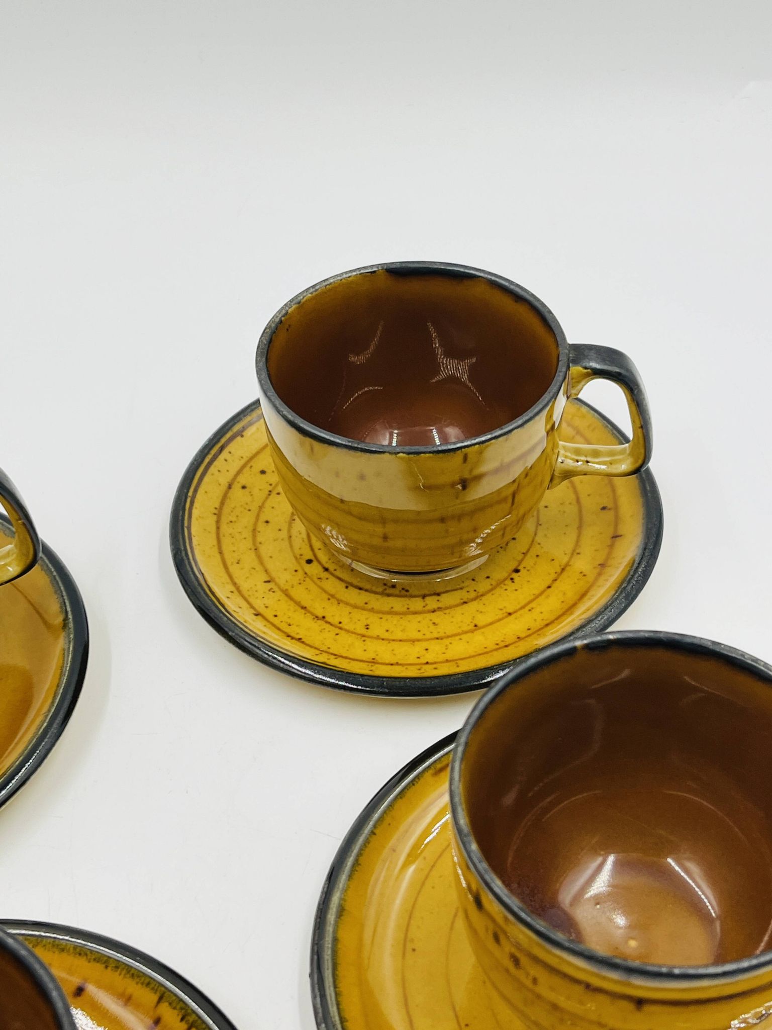 Set of four vintage Boch Palma cups and saucers.