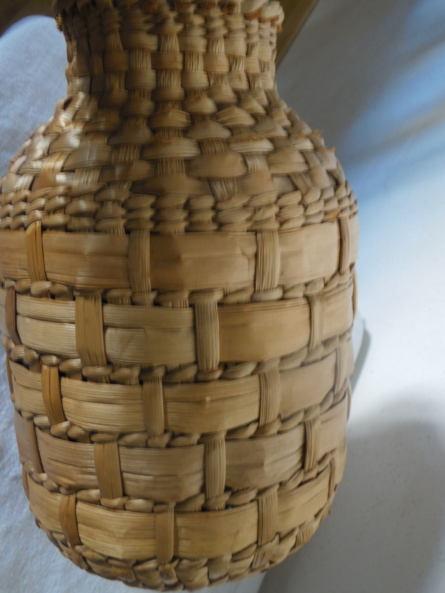 Pot in straw dress