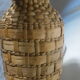 Pot in straw dress