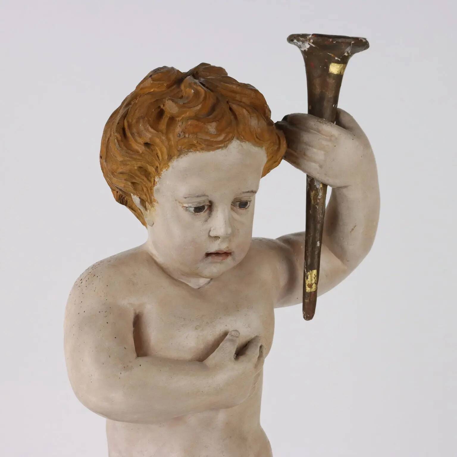 Ancient sculpture of a putto in carved and gilded wood, Italy, 19th century.