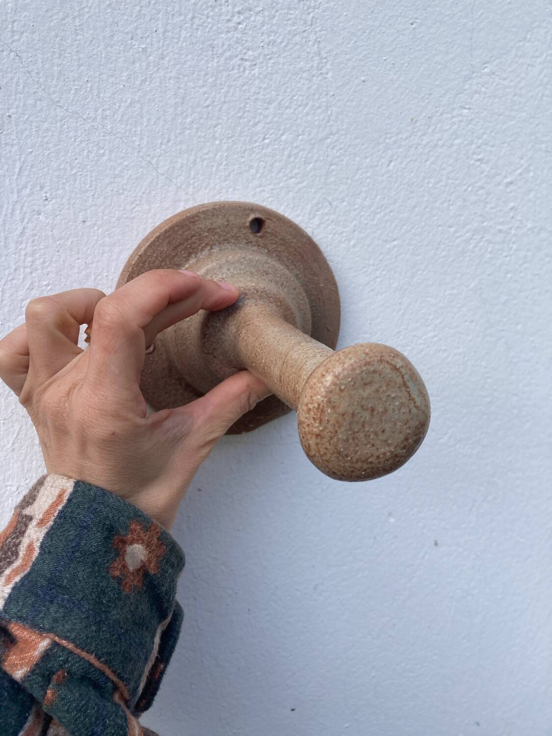 Coat hook sandstone wall light