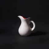 White and orange pitcher with organic curves