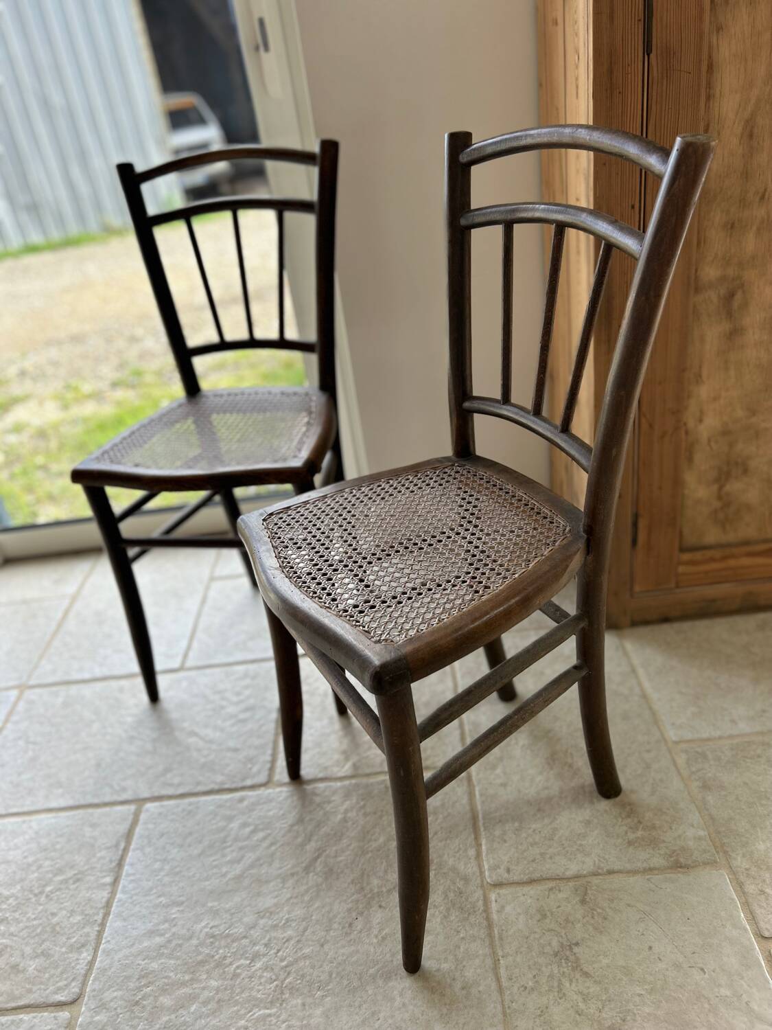Pair of cane bistro chairs