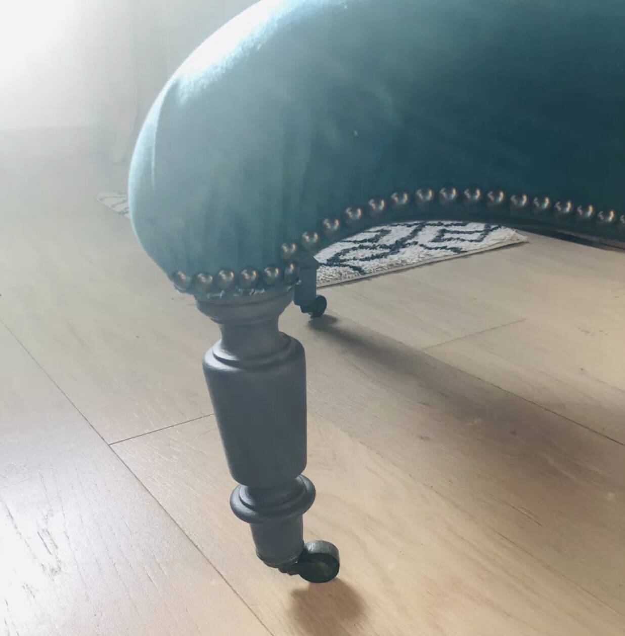 Velvet and studded armchair