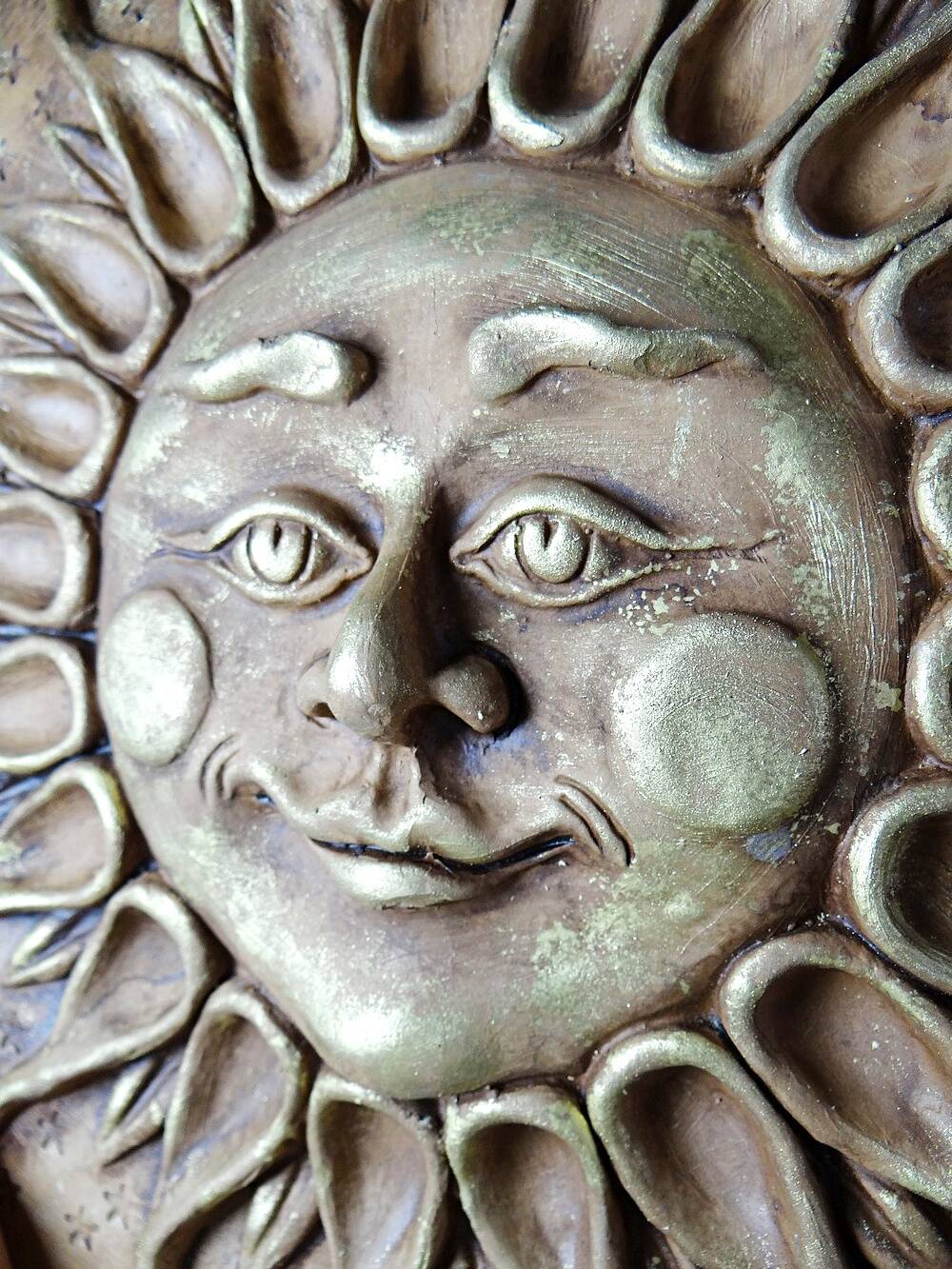 Anthropomorphic sun wall sculpture in patinated terracotta, vintage Italian craftsmanship.