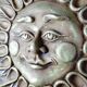 Anthropomorphic sun wall sculpture in patinated terracotta, vintage Italian craftsmanship.