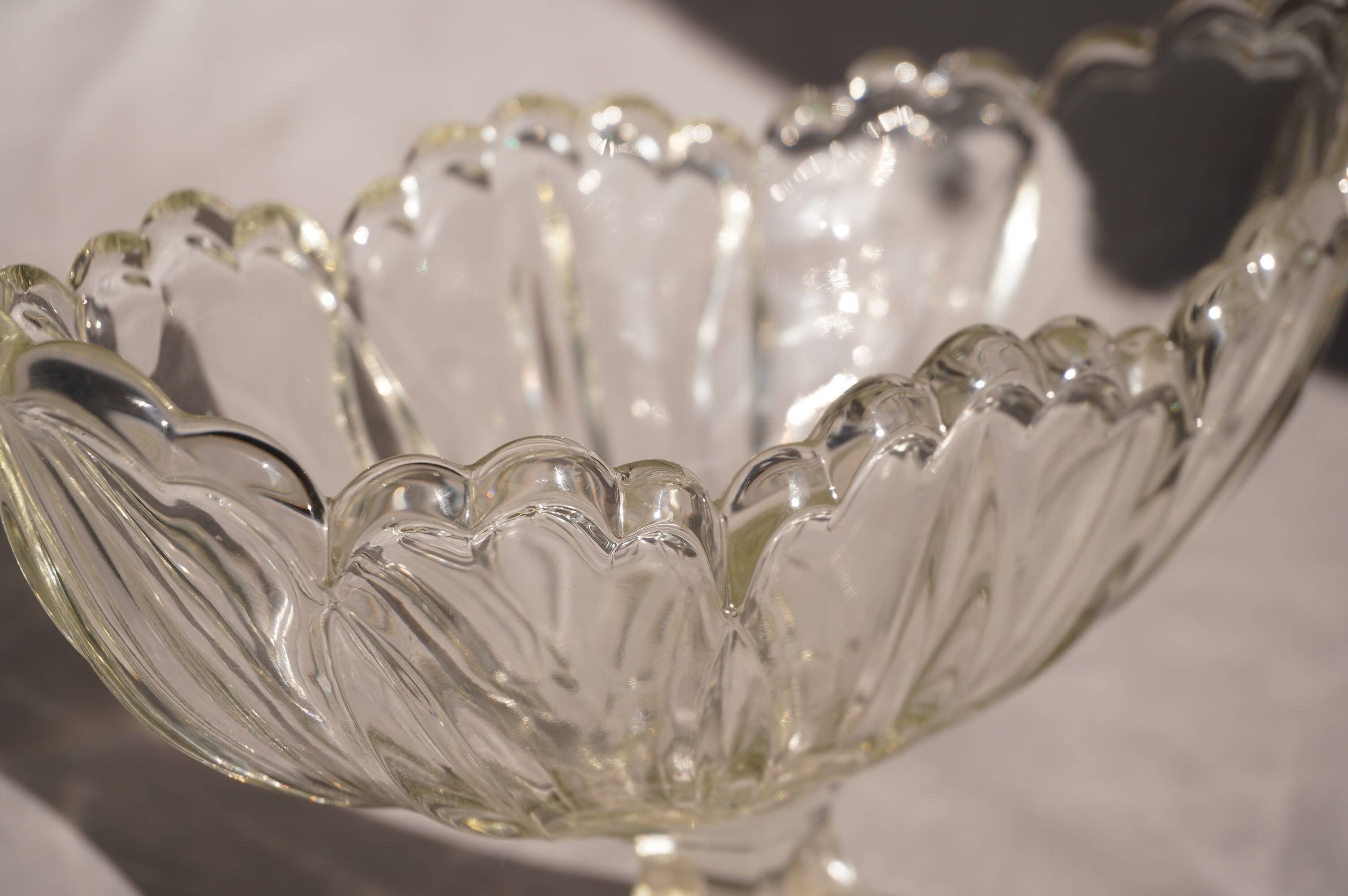 Oval glass fruit bowl on a stand.