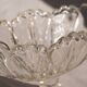 Oval glass fruit bowl on a stand.