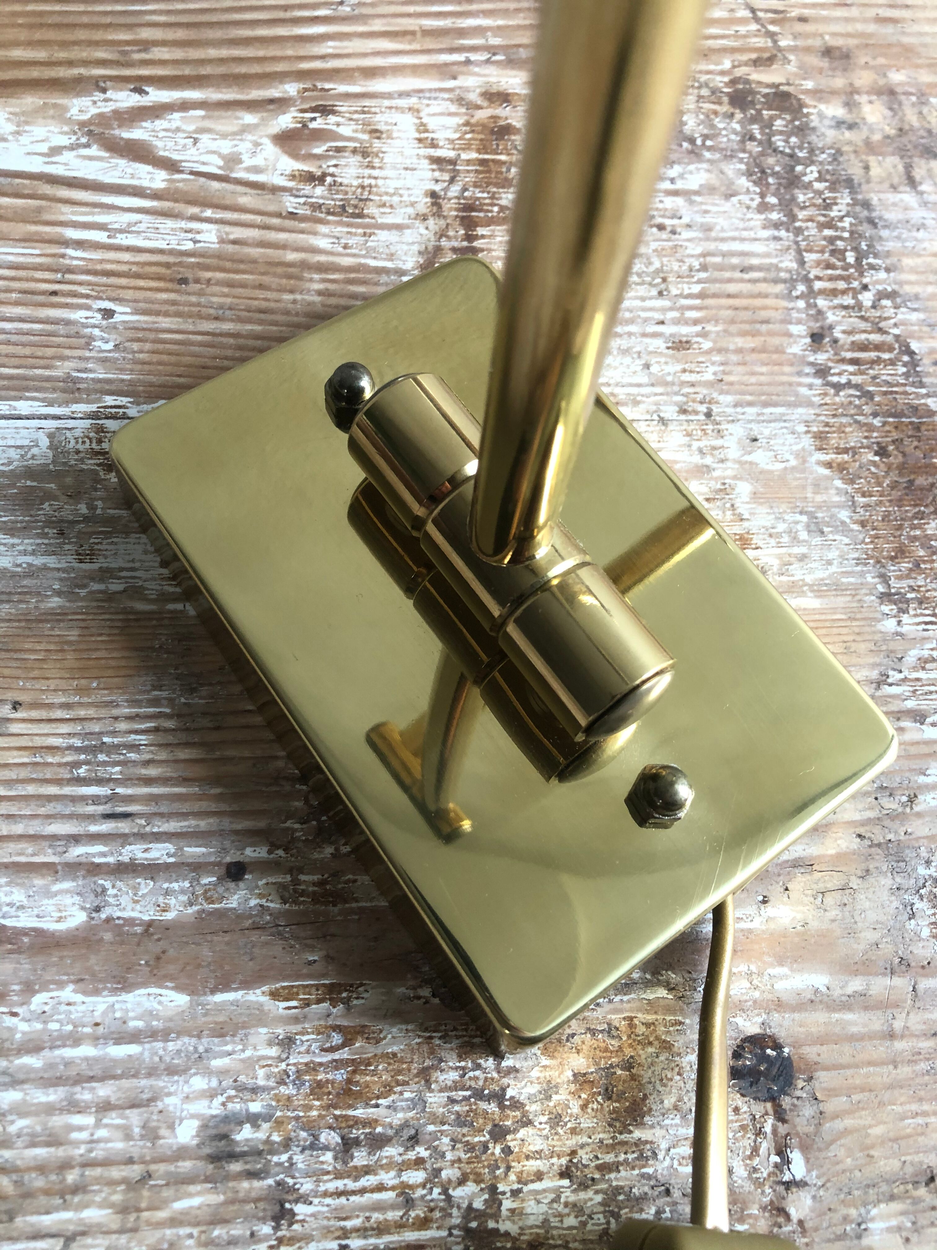 Deschuytener brass articulated wall lamp