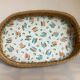 Old wicker basket tray with wooden beads.