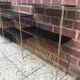 Black and gold metal string shelf with vinyl holder - vintage 1960