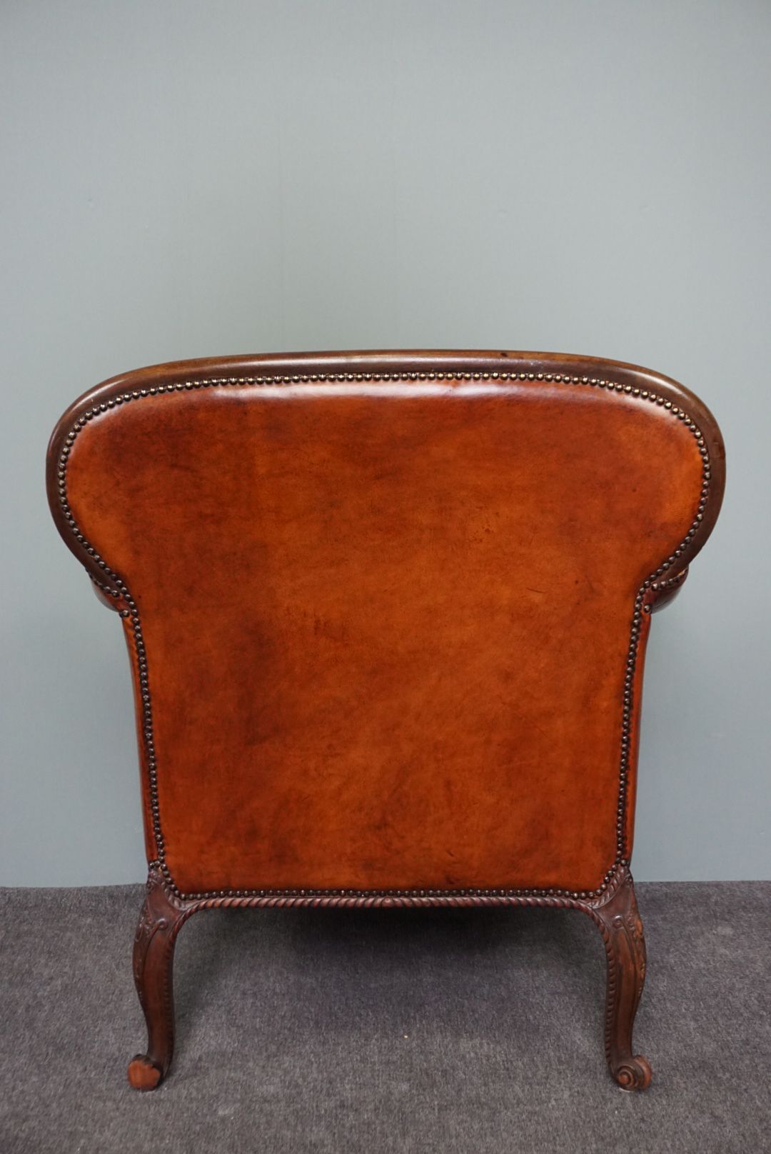 Old armchair in sheep leather