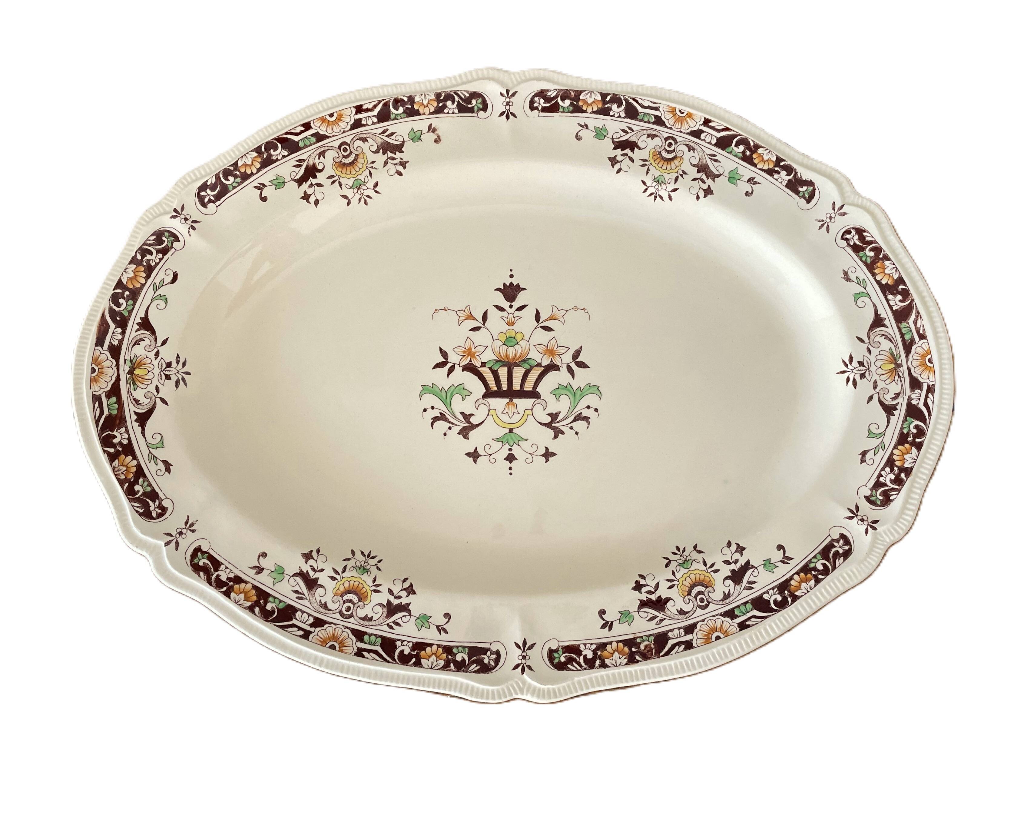 Antique serving dish in Longchamp earthenware.