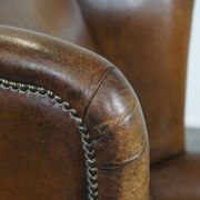 Sheepskin wing chair + XXL patinated footrest