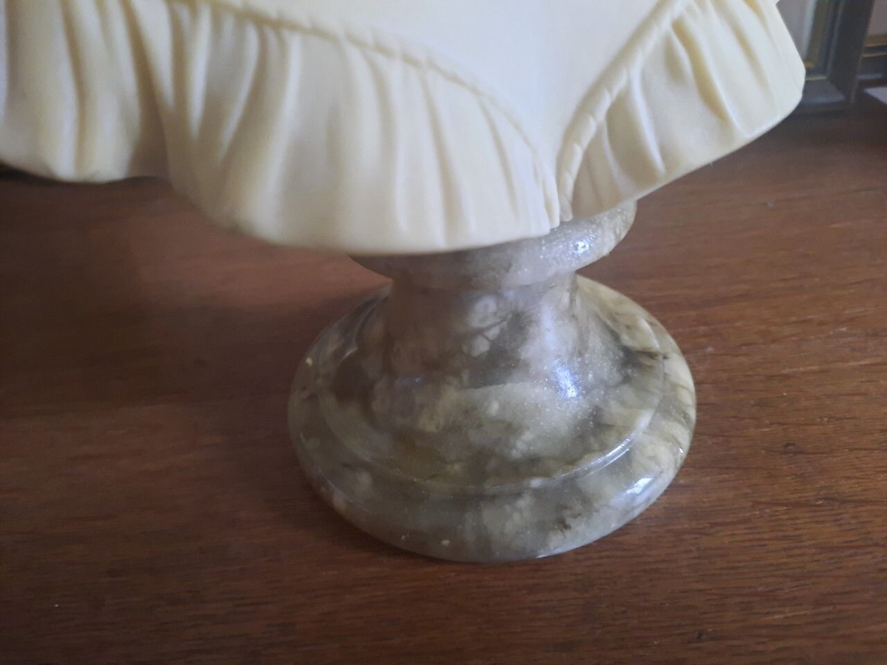 Bust woman on pedestal