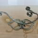 Pair of green lacquered wrought iron wall hooks, art deco, 1930s 40s