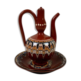 Terracotta teapot and saucer