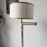 Floor lamp with articulated arm in brass-plated metal