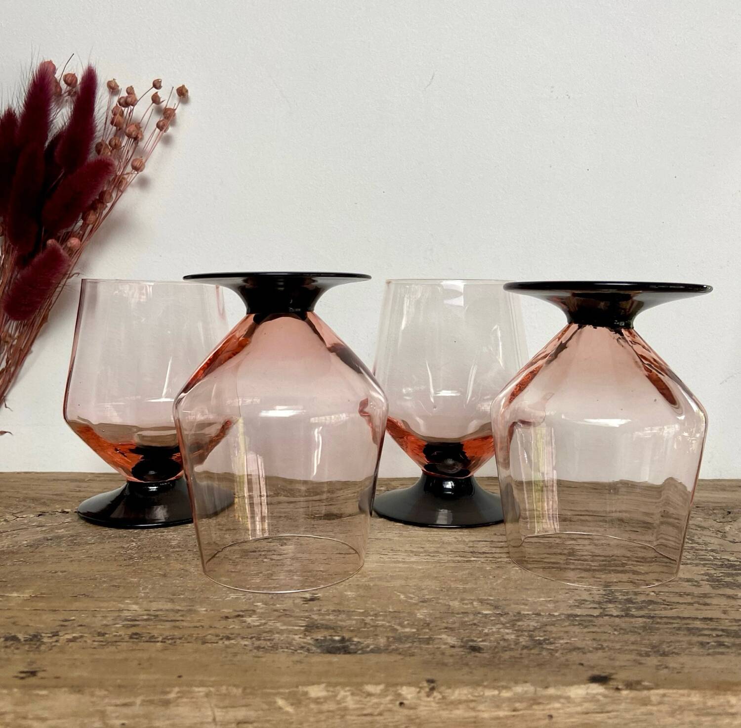 4 pink glasses with black stem