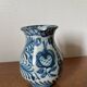 Blue ceramic pitcher with floral patterns