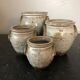 Set of 4 enamelled sandstone pots