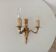 Vintage wall sconce in gilded brass, Empire style.