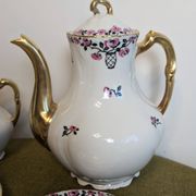 Service à café en porcelaine 18 pièces signé "Aux Lions de Faïence Paris"