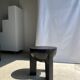 Black mango wood tripod side table with a semi-spherical top, height: 45 cm, diameter: 44 cm.