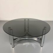 Round coffee table in smoked glass and chrome steel, 1970s design.