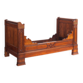 Bed made of solid walnut with marquetry details. France, 1930s.