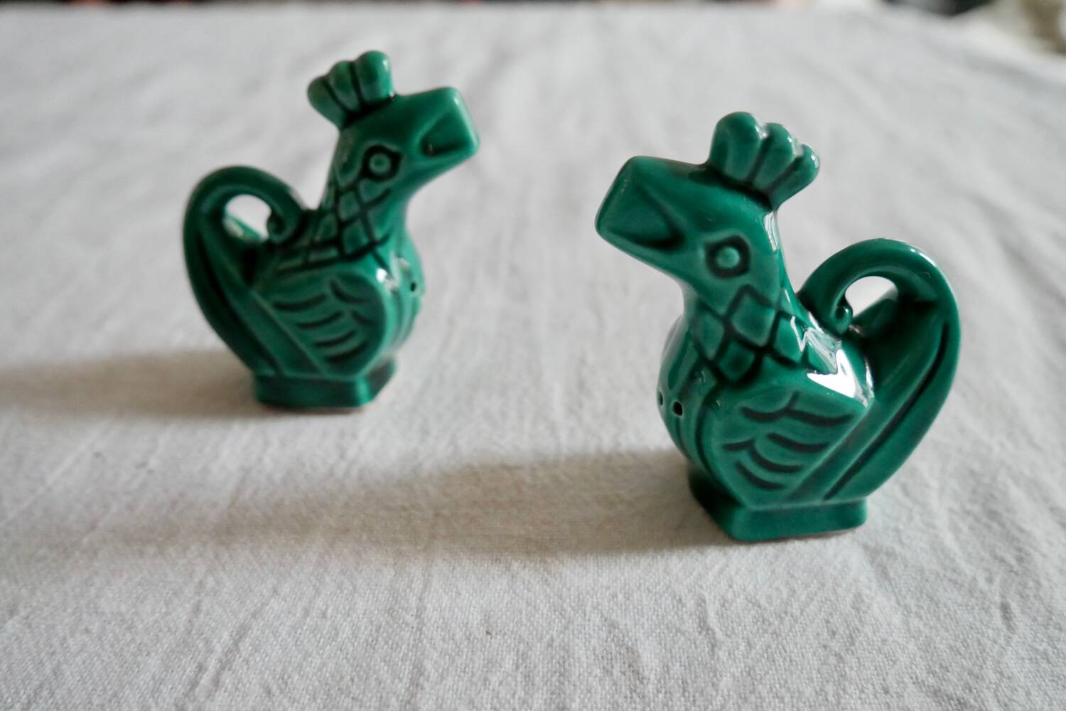 Slush salt and pepper shakers in the shape of a green rooster
