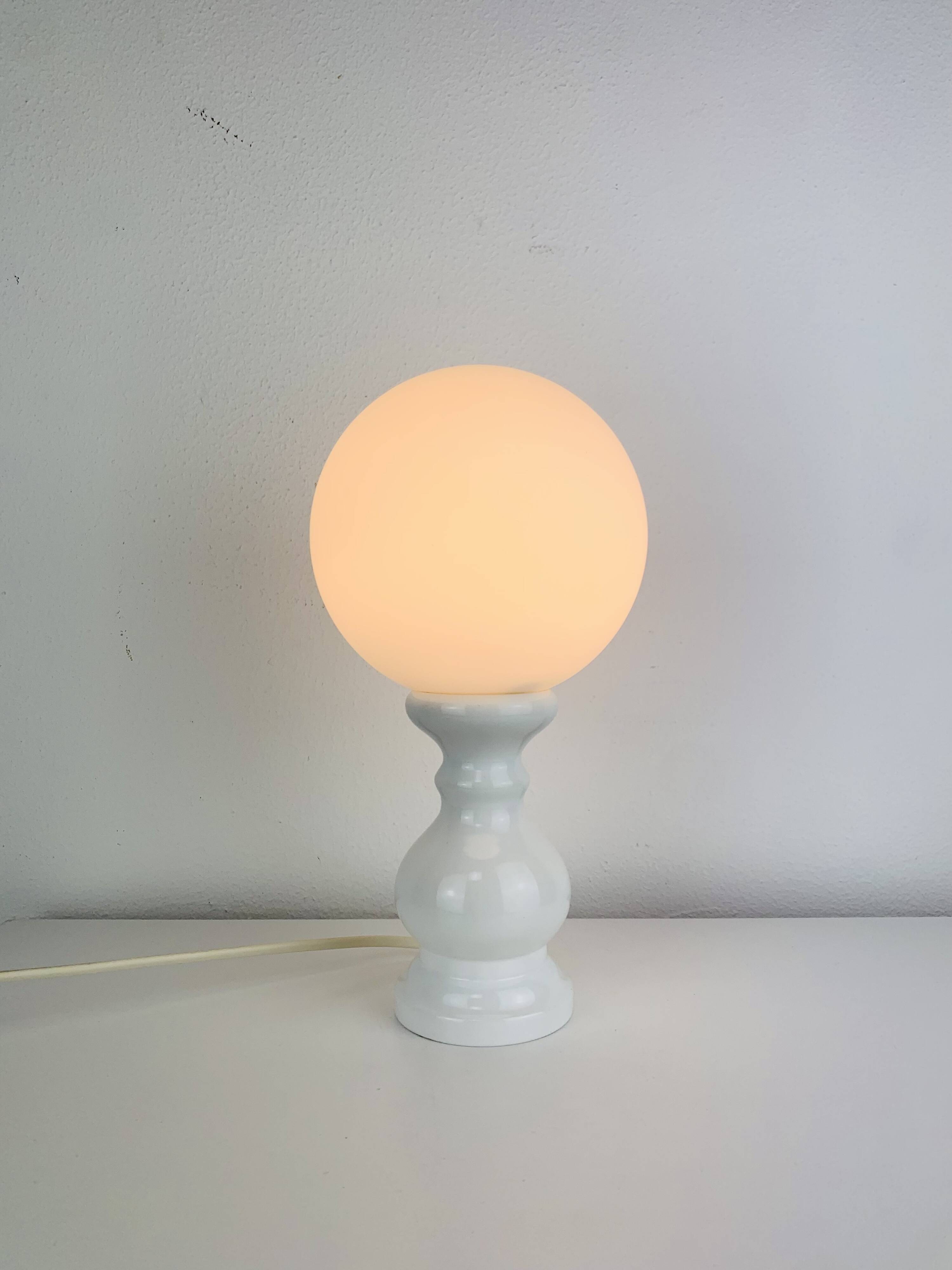Turned wood lamp with opaline glass globe, 1970s