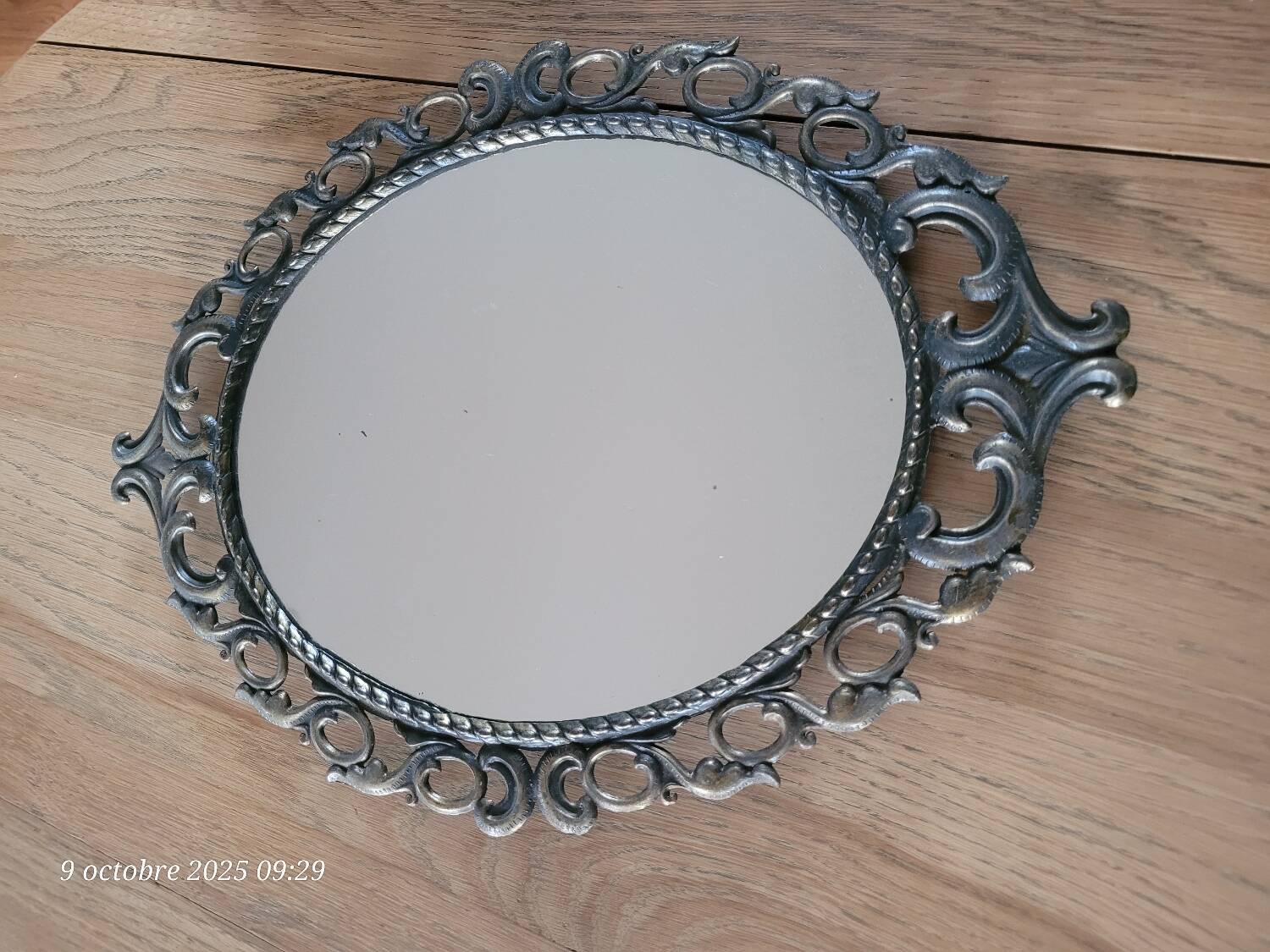 2 antique oval mirrors in heavy metal