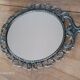 2 antique oval mirrors in heavy metal