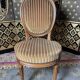 Suite de 4 chaises style Louis XVI médaillon
