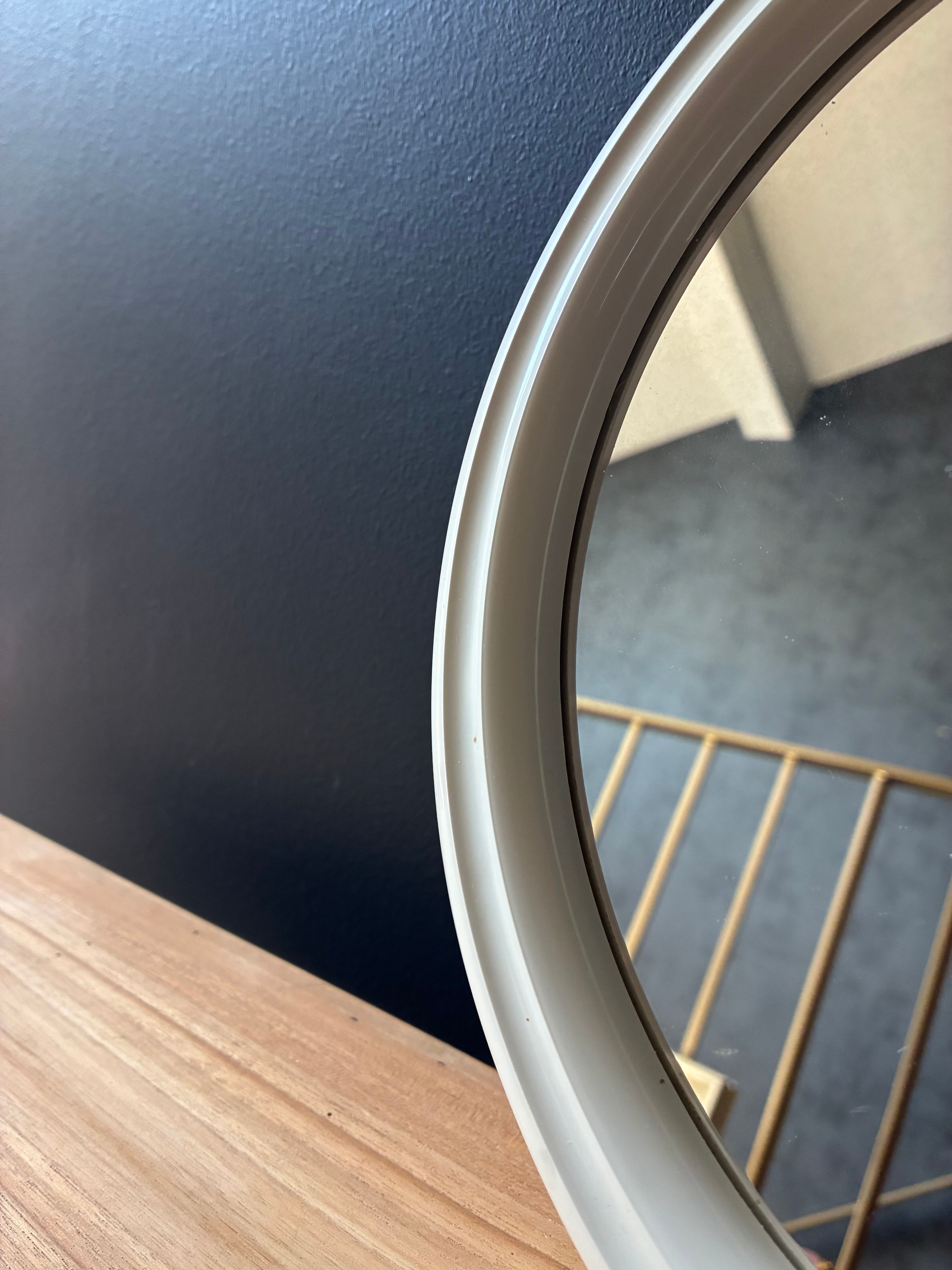 Vintage Space Age by Tiger small round mirror in moulded plastic.
