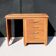 Bureau vintage en bois massif et placage de sapelli